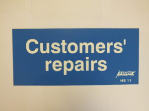 HS11 Customers repairs sign